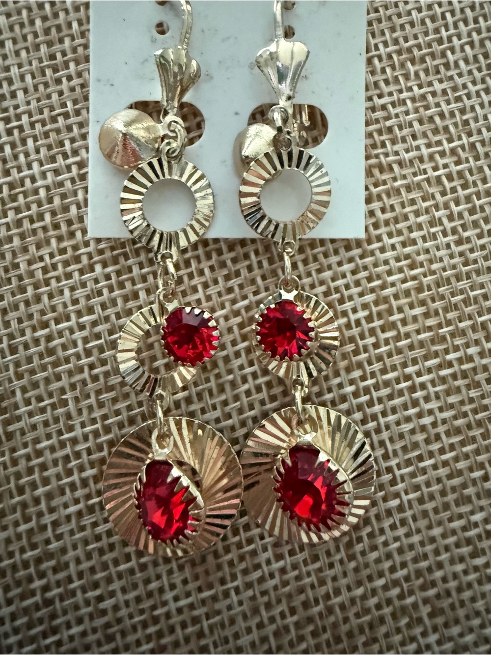 Gold Tone Dangle Earrings with Red Crystal Accents